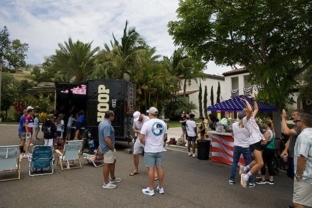Neighborhood block party gathered around the Hoop San Diego trailer